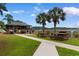 Community picnic area with a covered pavilion, picnic tables, BBQ and manicured landscaping at 4520 Coquina Harbour Dr. # F-3, Little River, SC 29566