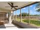 Enclosed porch with beautiful views, screen windows, and a ceiling fan at 4520 Coquina Harbour Dr. # F-3, Little River, SC 29566