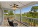 Outdoor balcony featuring tile floor, ceiling fan, and overlooking lush golf course at 4940 Windsor Green Way # 301, Myrtle Beach, SC 29579