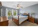 Comfortable bedroom with natural light, ceiling fan, and wooden furniture creates a relaxing atmosphere at 4940 Windsor Green Way # 301, Myrtle Beach, SC 29579