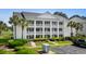 Attractive condo building with white columns, balconies, and well-maintained landscaping at 4940 Windsor Green Way # 301, Myrtle Beach, SC 29579