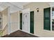 Charming front door entrance with decorative sidelights and a covered porch area at 4940 Windsor Green Way # 301, Myrtle Beach, SC 29579