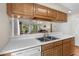 Pass through from kitchen to dining area with stainless steel sink and ample counter space at 4940 Windsor Green Way # 301, Myrtle Beach, SC 29579