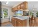 Bright kitchen with ample counter space and open view to the living area and balcony beyond at 4940 Windsor Green Way # 301, Myrtle Beach, SC 29579