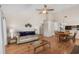 Spacious living room with hardwood floors, a cozy couch, and an adjacent dining area at 4940 Windsor Green Way # 301, Myrtle Beach, SC 29579