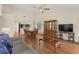 Open concept living room with hardwood floors, a dining area, and golf course views at 4940 Windsor Green Way # 301, Myrtle Beach, SC 29579