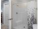 Modern shower with sleek fixtures and a stylish shower curtain at 4940 Windsor Green Way # 301, Myrtle Beach, SC 29579