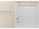 Clean bathroom showcasing a white tub and shower combination with built-in shelving at 5 Coffee Mill Creek Ln., Carolina Shores, NC 28467