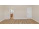 Bedroom with hardwood floors, view of bathroom, and a closet at 5 Coffee Mill Creek Ln., Carolina Shores, NC 28467