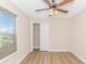 Bedroom featuring a ceiling fan, closet and a window for natural light at 5 Coffee Mill Creek Ln., Carolina Shores, NC 28467