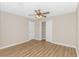 Bedroom featuring ceiling fan, closet, wood flooring and natural light at 5 Coffee Mill Creek Ln., Carolina Shores, NC 28467