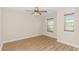 Bedroom with hardwood floors and fan at 5 Coffee Mill Creek Ln., Carolina Shores, NC 28467
