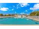 Large outdoor community swimming pool featuring ample seating, clear blue water, and a relaxing atmosphere at 5 Coffee Mill Creek Ln., Carolina Shores, NC 28467