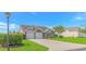 Charming two-story home features a two-car garage, brick accents, and a well-maintained front lawn at 5 Coffee Mill Creek Ln., Carolina Shores, NC 28467