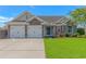 Charming brick home with a well-manicured lawn, two-car garage, and inviting front entrance at 5 Coffee Mill Creek Ln., Carolina Shores, NC 28467