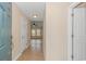 Bright foyer featuring neutral tones, tile flooring, and views into the adjacent living areas at 5 Coffee Mill Creek Ln., Carolina Shores, NC 28467
