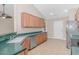 Well-lit kitchen featuring ample cabinet space, stainless steel appliances, and a corner sink at 5 Coffee Mill Creek Ln., Carolina Shores, NC 28467