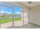 Screened patio with a view of the lawn and pond at 5 Coffee Mill Creek Ln., Carolina Shores, NC 28467