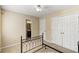 Carpeted bedroom offering a view into the en-suite bathroom at 500 Myrtle Greens Dr. # D, Conway, SC 29526