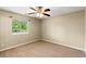 A carpeted bedroom featuring a ceiling fan and a window at 500 Myrtle Greens Dr. # D, Conway, SC 29526