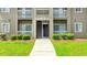 Condo exterior with white railings and lush green lawn at 500 Myrtle Greens Dr. # D, Conway, SC 29526