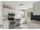 Modern kitchen with stainless steel appliances and white cabinets at 500 Myrtle Greens Dr. # D, Conway, SC 29526