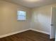 Bedroom with hardwood floors, window, and fresh paint at 505 1St Ave. S, North Myrtle Beach, SC 29582