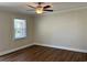 Bedroom with hardwood floors, window, and a ceiling fan at 505 1St Ave. S, North Myrtle Beach, SC 29582