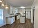 Beautifully updated kitchen with white cabinets, stainless steel appliances, and granite countertops at 505 1St Ave. S, North Myrtle Beach, SC 29582