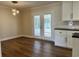 Dining area off kitchen featuring hardwood floors and a view of the sunroom at 505 1St Ave. S, North Myrtle Beach, SC 29582