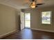 Inviting living room featuring hardwood floors and natural light streaming through the window at 505 1St Ave. S, North Myrtle Beach, SC 29582