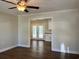 Open living room with hardwood floors and a view into the kitchen through a doorway at 505 1St Ave. S, North Myrtle Beach, SC 29582