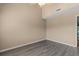 A bright bedroom with neutral walls, gray flooring, and a ceiling fan at 510 Fairwood Lakes Dr. # 19-Q, Myrtle Beach, SC 29588
