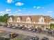 Well-maintained townhouse complex featuring ample parking and traditional architecture under a bright blue sky at 510 Fairwood Lakes Dr. # 19-Q, Myrtle Beach, SC 29588