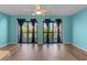 Bright, open-concept living room with modern floors, ceiling fan, and sliding glass doors to a patio at 510 Fairwood Lakes Dr. # 19-Q, Myrtle Beach, SC 29588