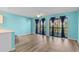 Bright, open-concept living room with modern floors, ceiling fan, and sliding glass doors to a patio at 510 Fairwood Lakes Dr. # 19-Q, Myrtle Beach, SC 29588