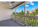 Screened porch with ceiling fan, offering a relaxing view of lush greenery and sky at 510 Fairwood Lakes Dr. # 19-Q, Myrtle Beach, SC 29588