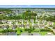 Aerial view of a residential neighborhood featuring many houses, ponds and mature trees at 5146 Fairmont Ln., Myrtle Beach, SC 29579