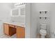 Modern bathroom features double vanity with lighted mirrors and neutral finishes at 5146 Fairmont Ln., Myrtle Beach, SC 29579