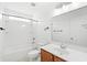 Clean bathroom with a tub-shower combo, toilet, and vanity with wooden cabinets at 5146 Fairmont Ln., Myrtle Beach, SC 29579