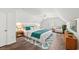 Cozy bedroom with a large bed, matching nightstands and warm, inviting decor at 5146 Fairmont Ln., Myrtle Beach, SC 29579