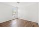 Bright bedroom with hardwood floors and ample natural light from a large window at 5146 Fairmont Ln., Myrtle Beach, SC 29579
