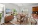 The dining room features a large table set for six, and a sliding glass door to the porch at 5146 Fairmont Ln., Myrtle Beach, SC 29579
