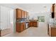 Well-lit kitchen with granite countertops, stainless steel appliances, and ample cabinet space at 5146 Fairmont Ln., Myrtle Beach, SC 29579