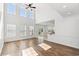 Inviting living room boasts hardwood floors, high ceilings, and large windows for ample light at 5146 Fairmont Ln., Myrtle Beach, SC 29579
