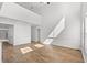 Bright living room featuring hardwood floors, a high ceiling, and abundant natural light at 5146 Fairmont Ln., Myrtle Beach, SC 29579