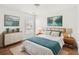 Well-lit main bedroom featuring serene artwork, a cozy rug and comfortable bedding at 5146 Fairmont Ln., Myrtle Beach, SC 29579