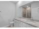 Bathroom featuring dual sinks with granite countertops and cabinetry for ample storage and organization at 5310 Knobcone Loop # B, Myrtle Beach, SC 29577