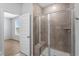 Modern bathroom with a glass shower, bench, and tile surround, showcasing the new home's design at 5310 Knobcone Loop # B, Myrtle Beach, SC 29577