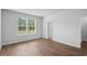 Cozy bedroom with hardwood floors and a window overlooking the backyard at 5310 Knobcone Loop # B, Myrtle Beach, SC 29577